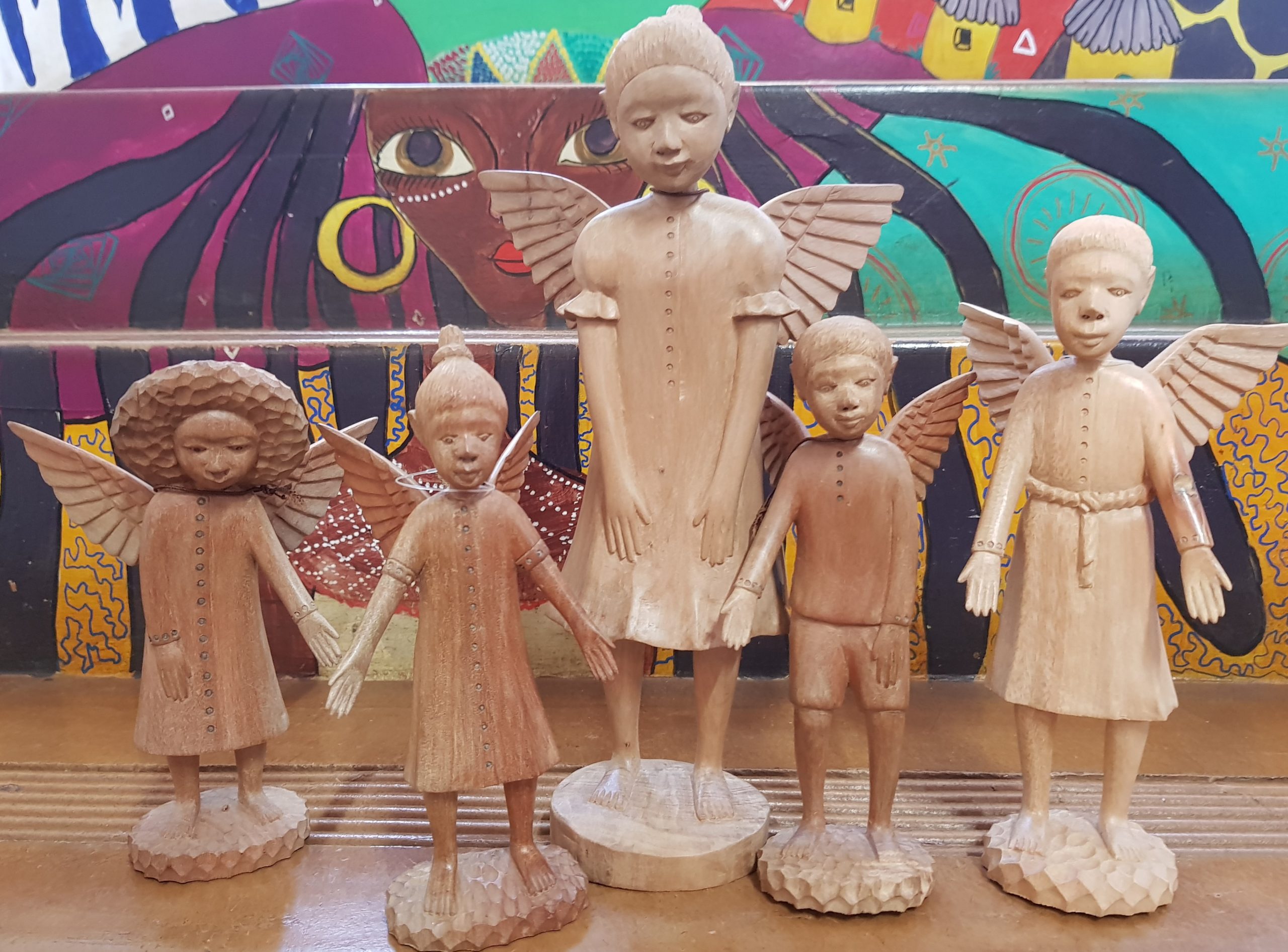 A choir of little wooden angels at Woza Moya in Hillcrest