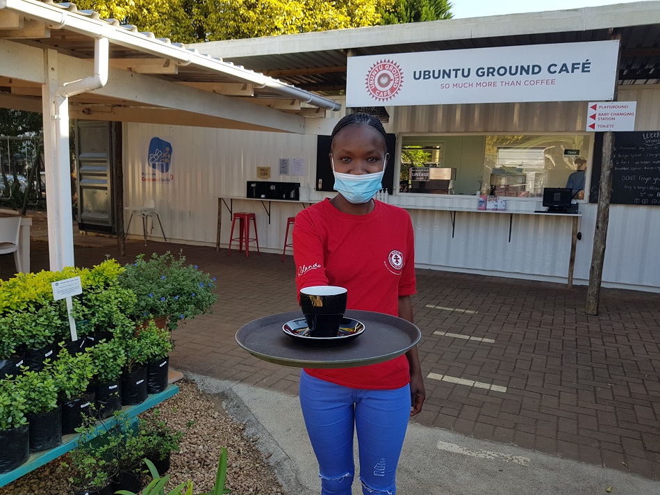 Ubuntu Ground Coffee at Hillcrest Aids Centre, waitress Cebile Malevu serves an early morning pick me up.