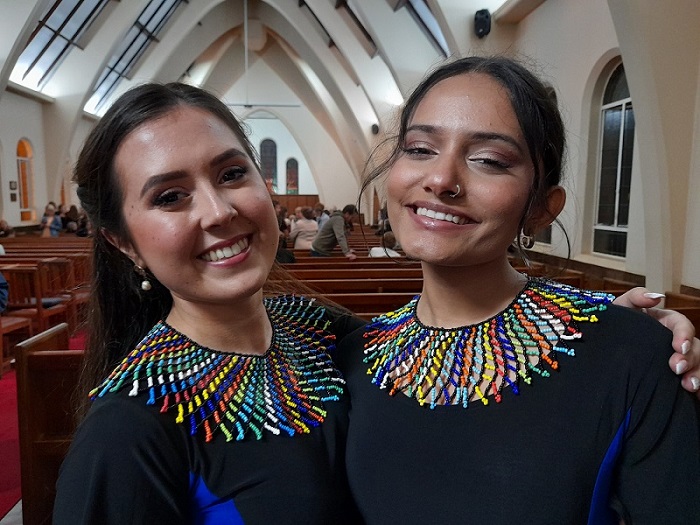 KZN Youth choir members Nicole Snell and Dhenishta Chetty wearing their new necklaces.